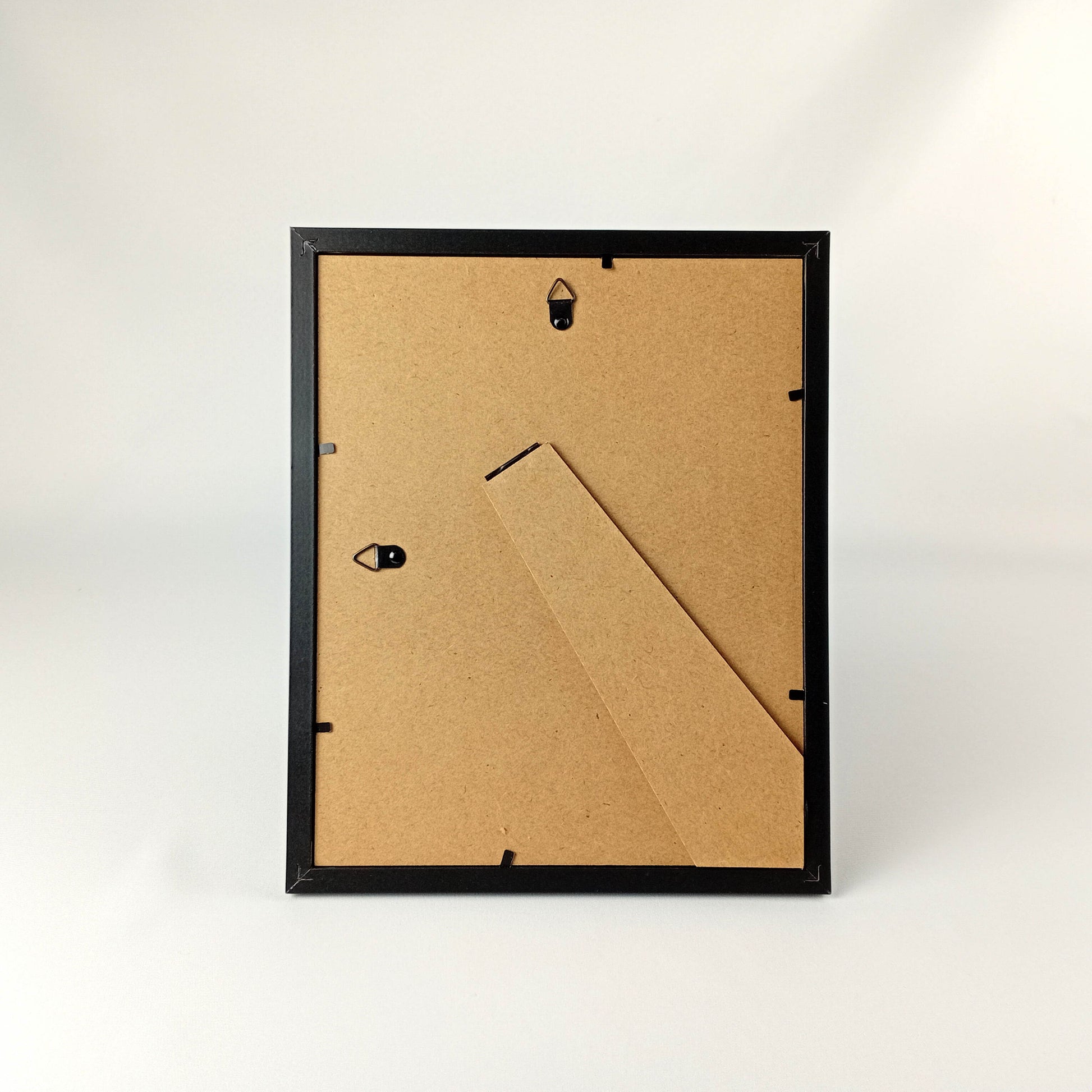 Framed fabric art with a single tree and mountain image