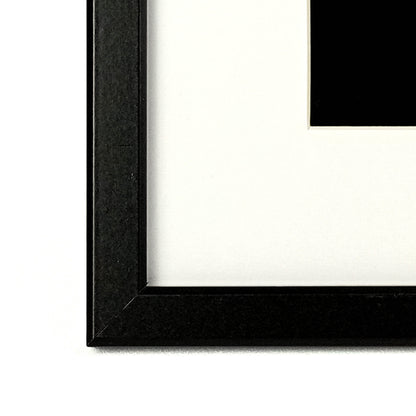 Framed fabric art with a single tree and mountain image