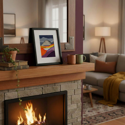 Framed fabric artwork sitting on a fireplace mantle in a modern living room