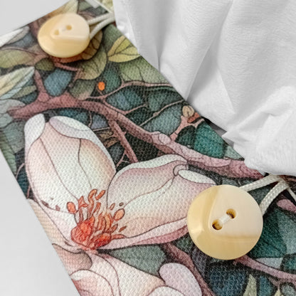 Close up view of square linen tissue box cover with buttons