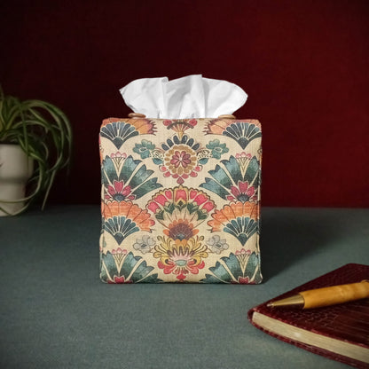 Square tissue box cover with pen, notebook, and plant