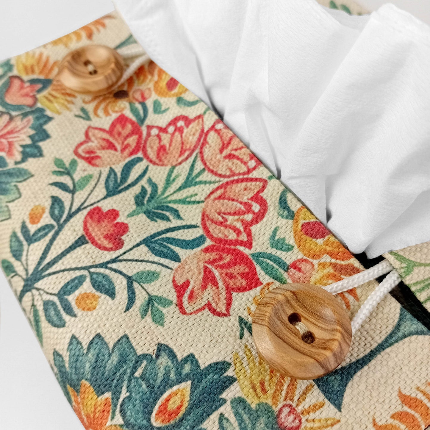 Close up view of square tissue box cover with buttons