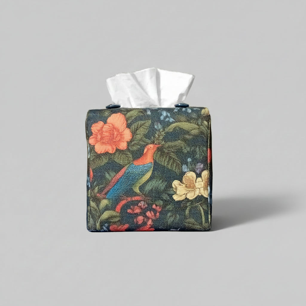 Square linen tissue box cover with a colourful bird and floral design on a dark blue background