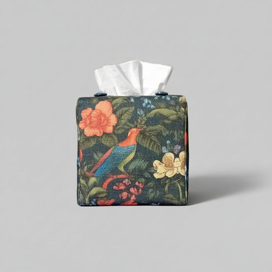 Cube linen tissue box cover with a colourful bird and floral design on a dark blue background