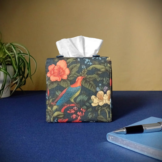 Cube linen tissue box cover with a colourful bird and floral design on a dark blue background