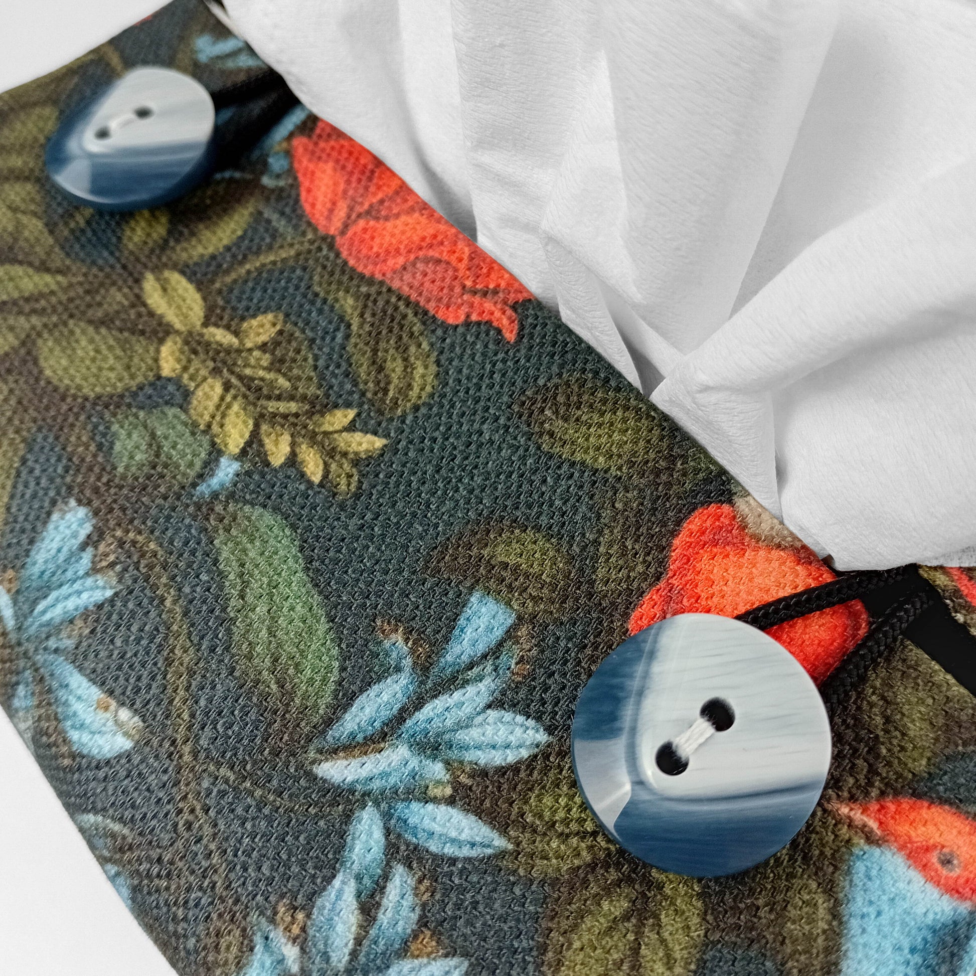 Close up view of linen tissue box cover with buttons