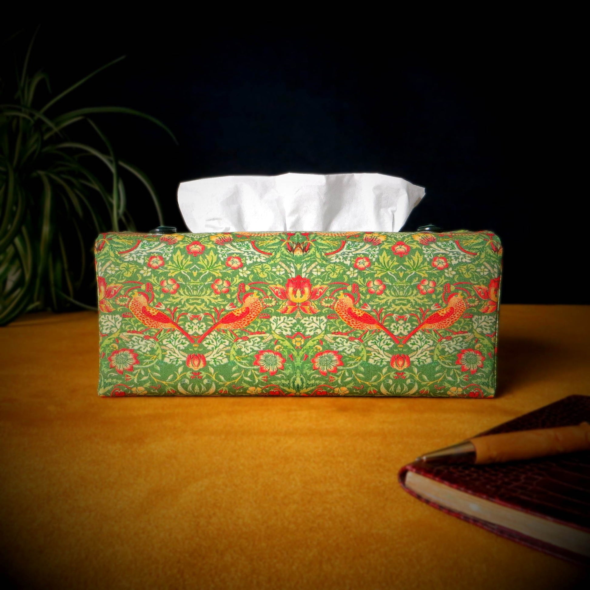 Rectangle tissue box cover with a pen, notebook, and plant
