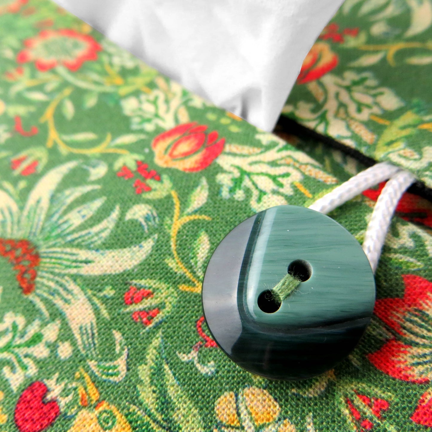 Close up view of rectangle tissue box cover with buttons