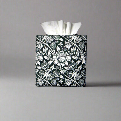 Square tissue box cover with white flowering vine design on black background