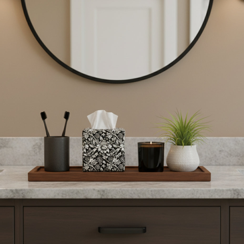 Square tissue box cover with white flowering vine design on black background