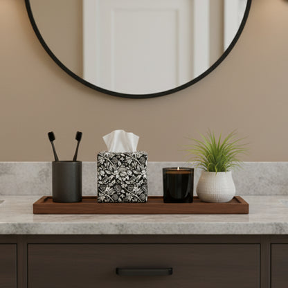Square tissue box cover with white flowering vine design on black background