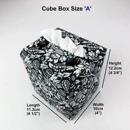 Square tissue box cover with white flowering vine design on black background