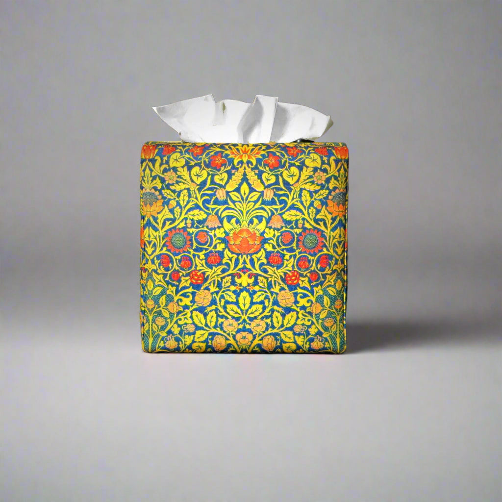 Cube tissue box cover with orange flowers and yellow vines design on blue background