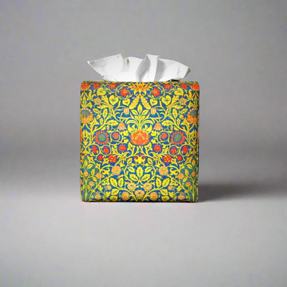 Cube tissue box cover with orange flowers and yellow vines design on blue background