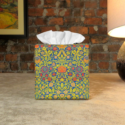 Cube tissue box cover with orange flowers and yellow vines design on blue background