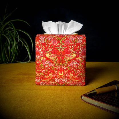 Square tissue box cover with pen, notebook, and plant