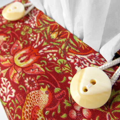 Close up view of square tissue box cover with buttons