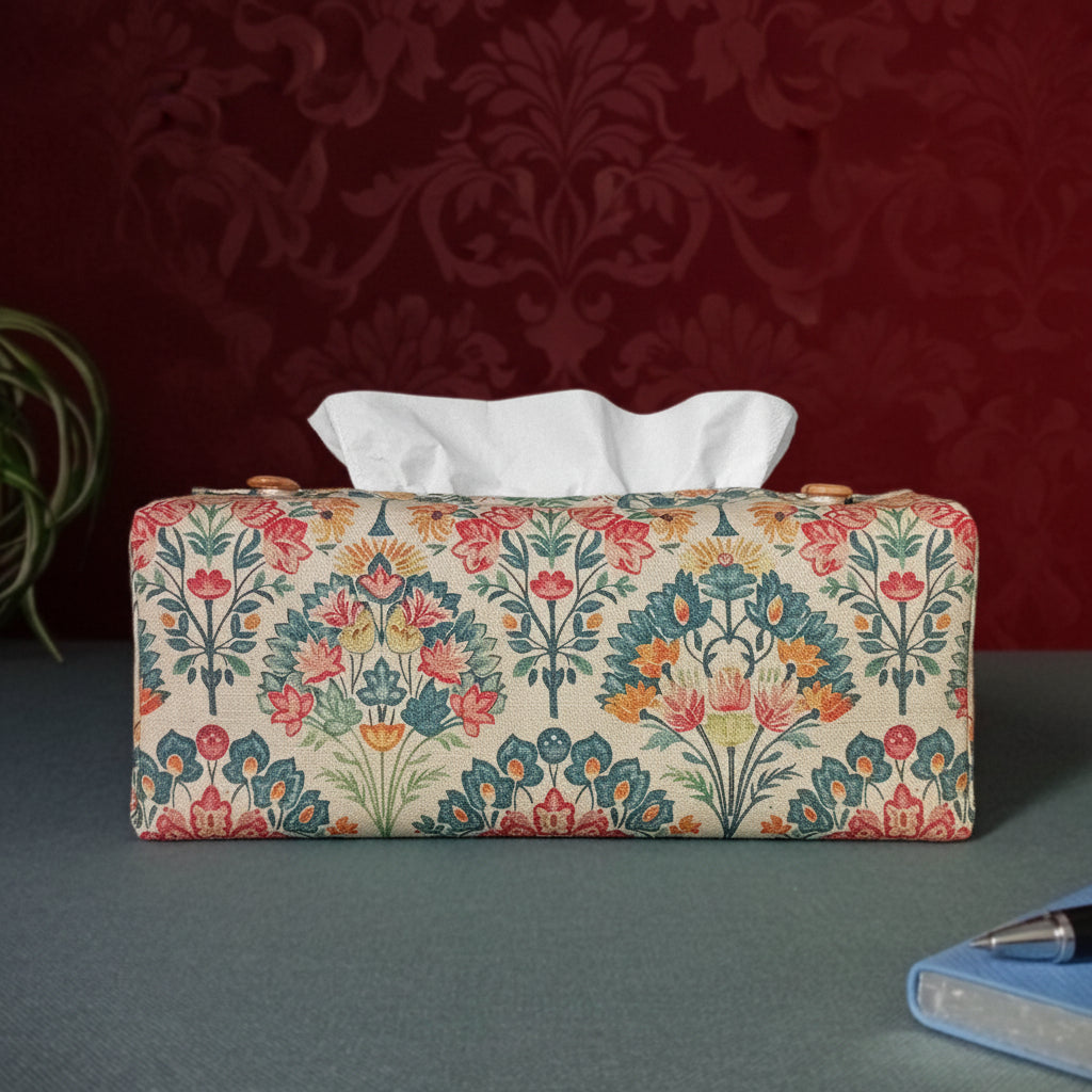 Linen tissue box cover with a pen, notebook, and plant