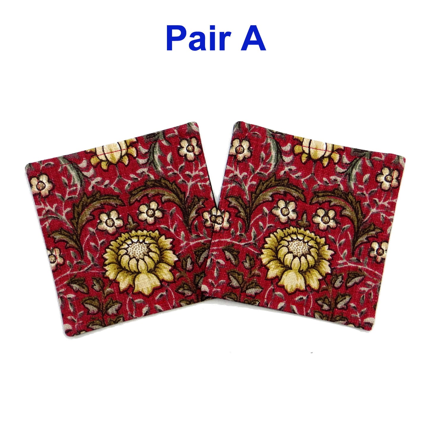 Square coasters with yellow and white flowers, and brown leaves on red background