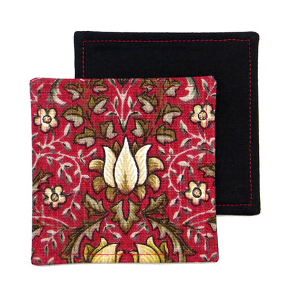 Square coasters with yellow and white flowers, and brown leaves on red background