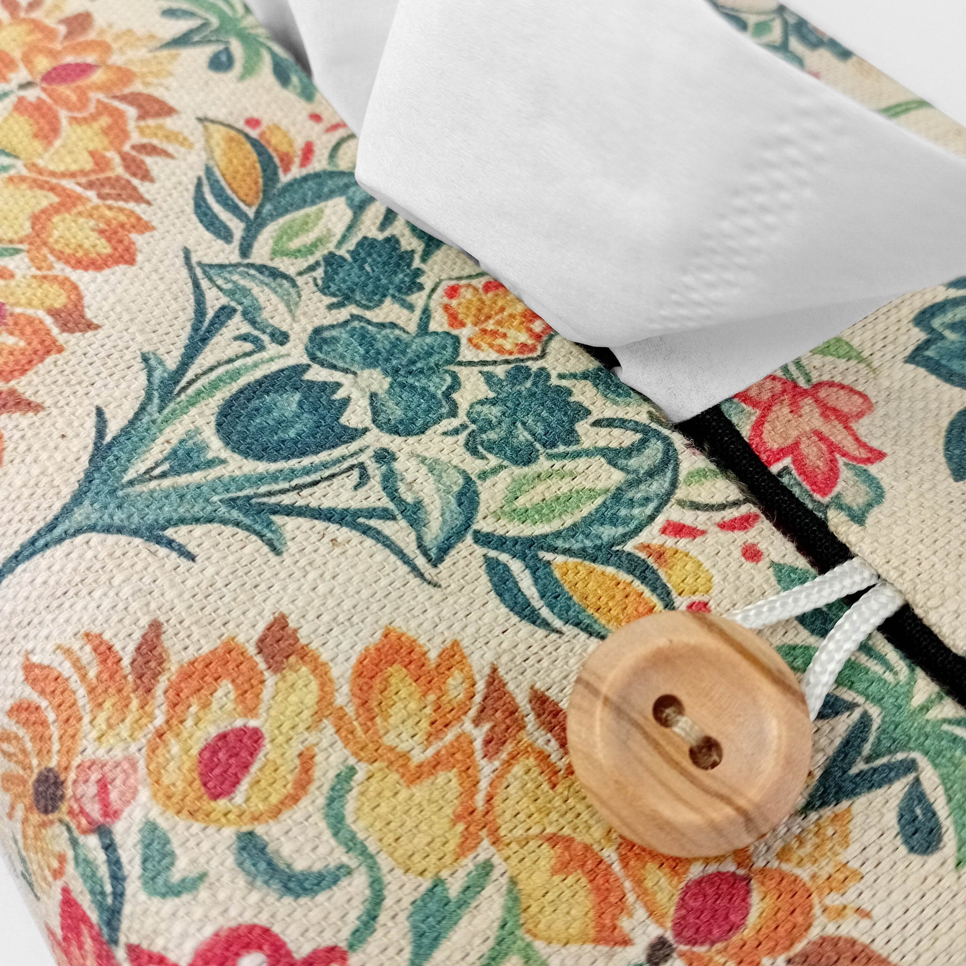 Close up of linen tissue box cover with buttons
