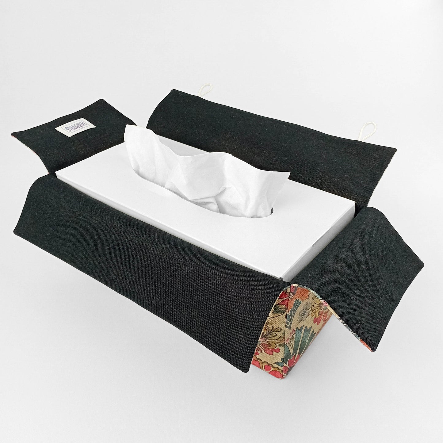 Linen tissue box cover with a colourful folding fan motif pattern on an antiqued tan background