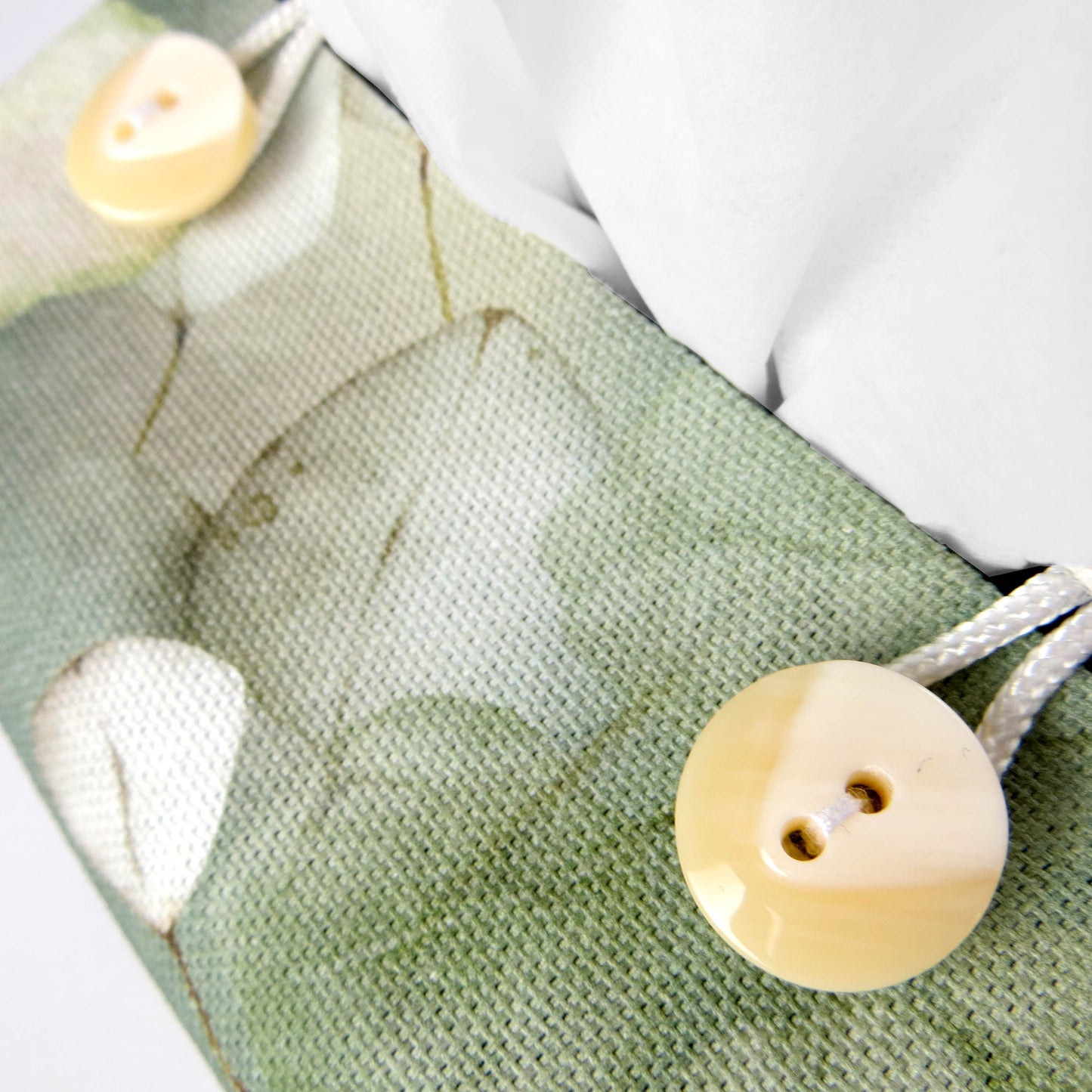 Close up view of printed cotton square tissue box cover with buttons