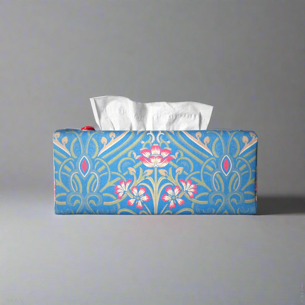 Rectangular tissue box cover with red flowers with green Victorian embellishment on blue background