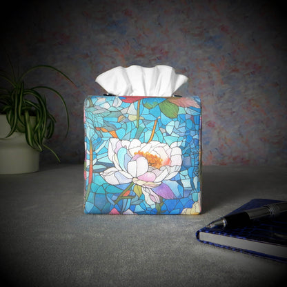 Square tissue box cover with pen, notebook, and plant