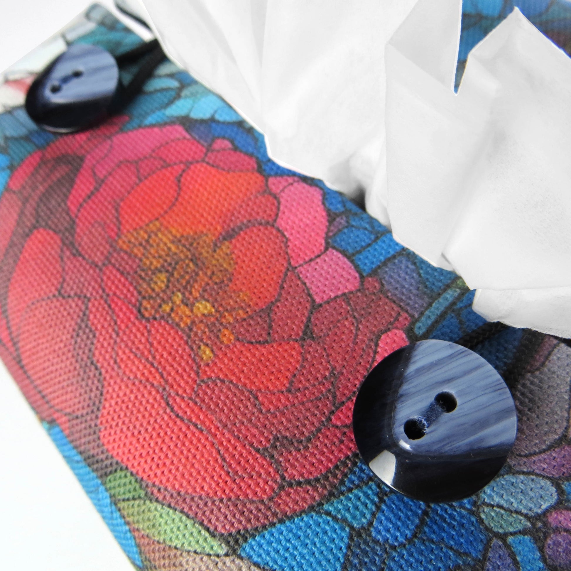 Close up view of square tissue box cover with buttons