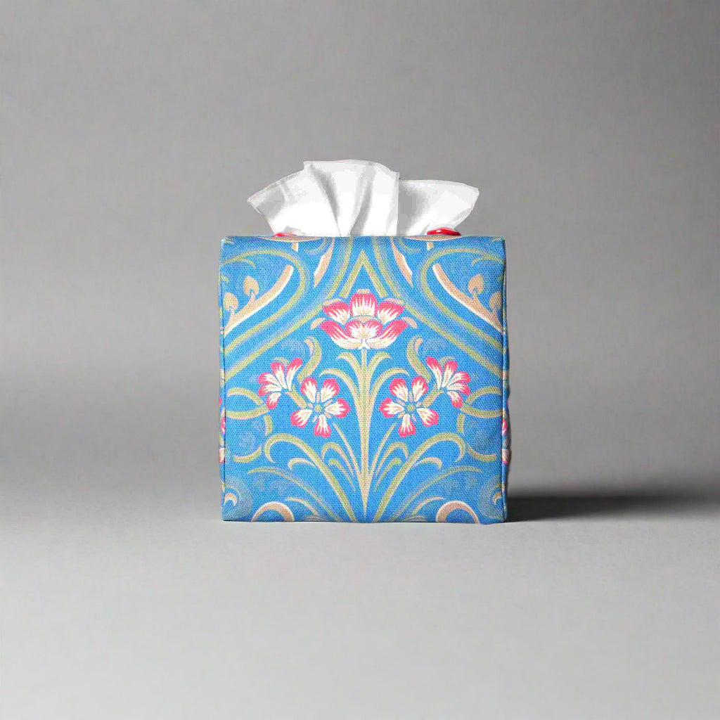 Square tissue box cover with red flowers and green Victorian embellishment on blue background