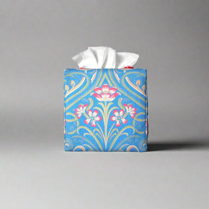 Square tissue box cover with red flowers and green Victorian embellishment on blue background