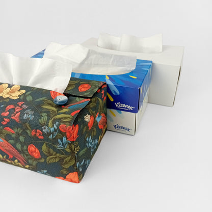 Linen tissue box cover with bright and colourful birds and flowers on a dark blue background