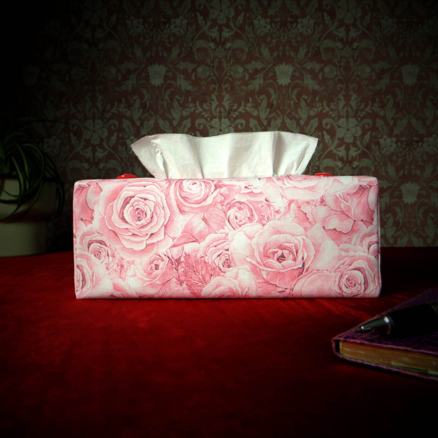 Cotton rectangle tissue box cover with a pen, notebook, and plant
