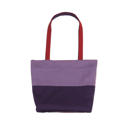 Front view of a large cotton tote bag with two vibrant colours on each side