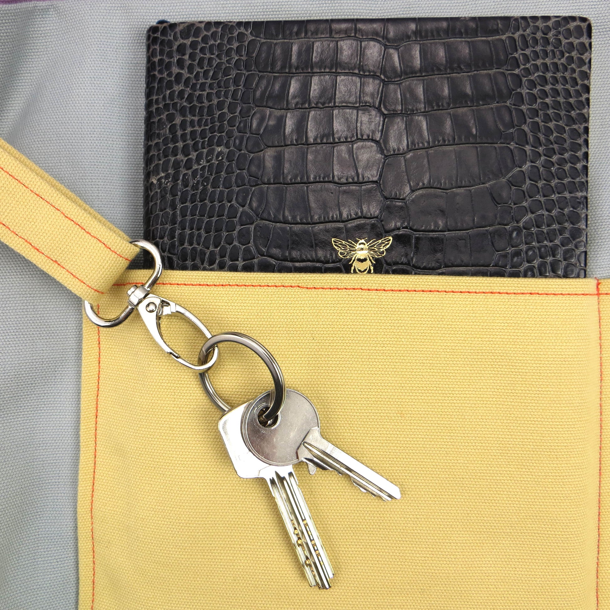 Close up view of a large tote bag interior key clasp