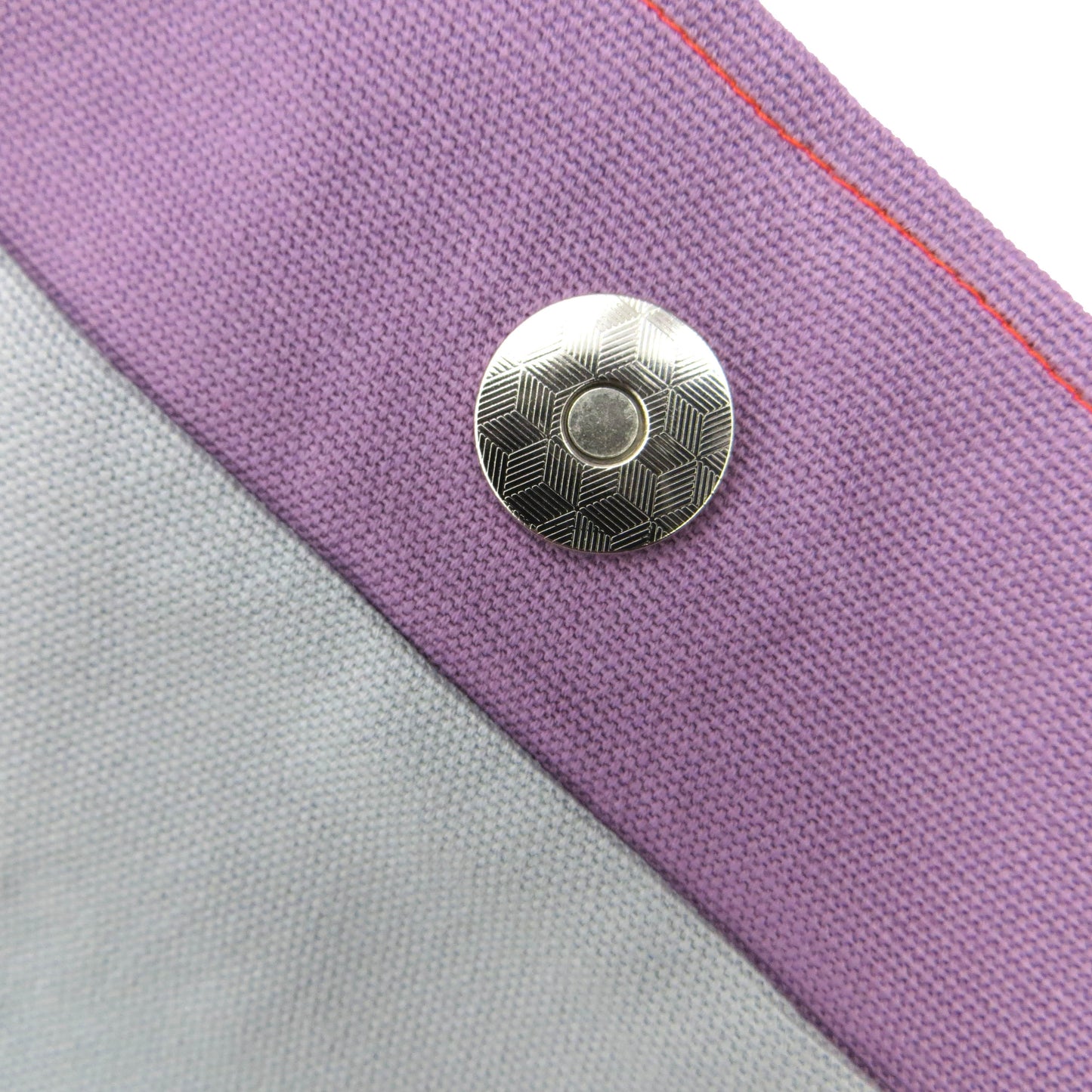 Close up view of a large tote bag magnetic closure