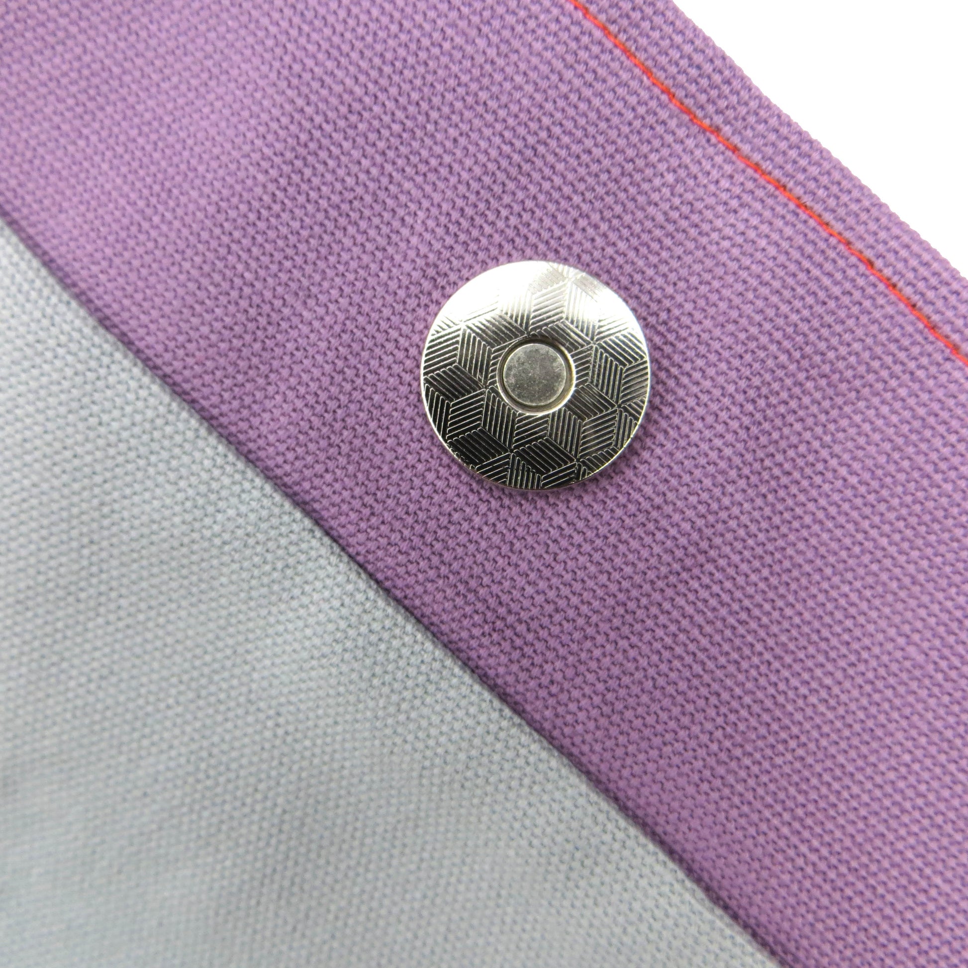 Close up view of a large tote bag magnetic closure