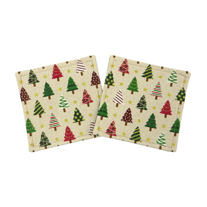 Set of two handmade cotton square coasters with a festive holiday design of decorated trees in red, green, and white on a beige background