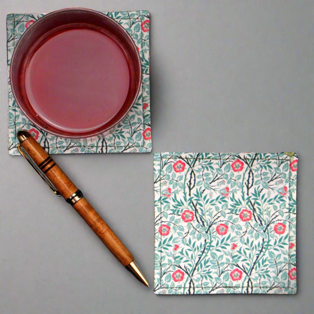 Set of 2 handmade coasters  featuring red flowers and green vines on an off-white background