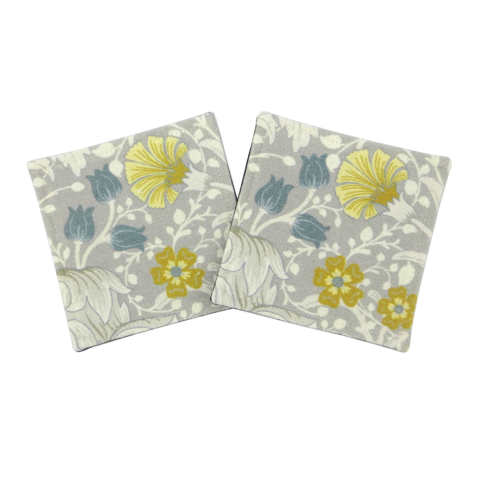 Set of 2 handmade coasters with white magnolia flowers and blue, yellow, and grey accents
