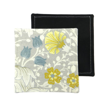 Set of 2 handmade coasters with white magnolia flowers and blue, yellow, and grey accents