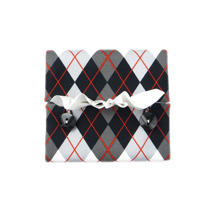 Square tissue box cover with black, grey, and red argyle pattern