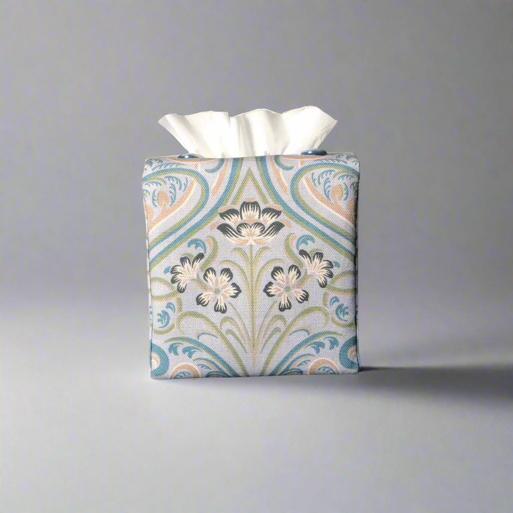 Square tissue box cover with charcoal grey and white flowers with blue, green and taupe Victorian embellishment on blue-grey background