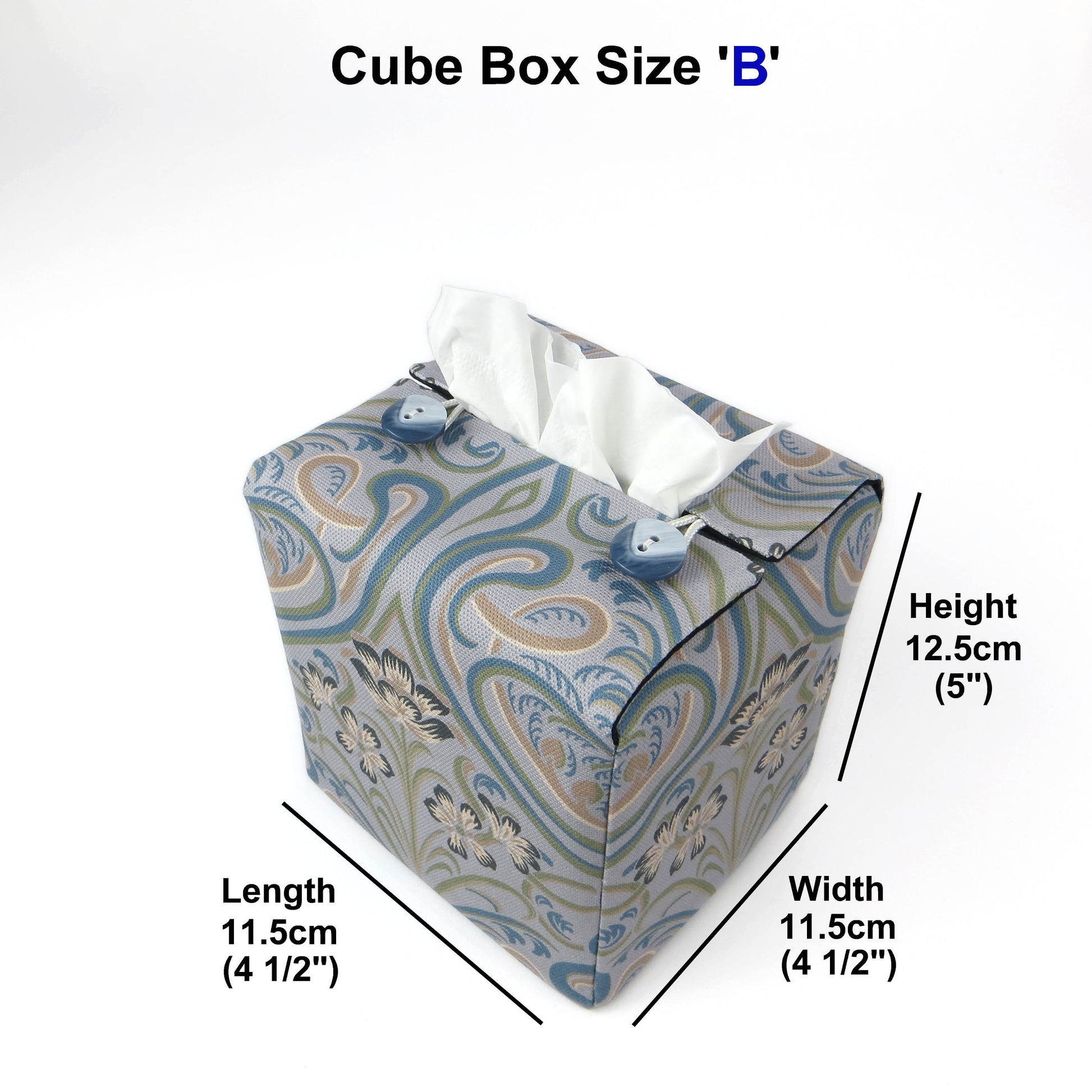 Square tissue box cover with charcoal grey and white flowers with blue, green and taupe Victorian embellishment on blue-grey background