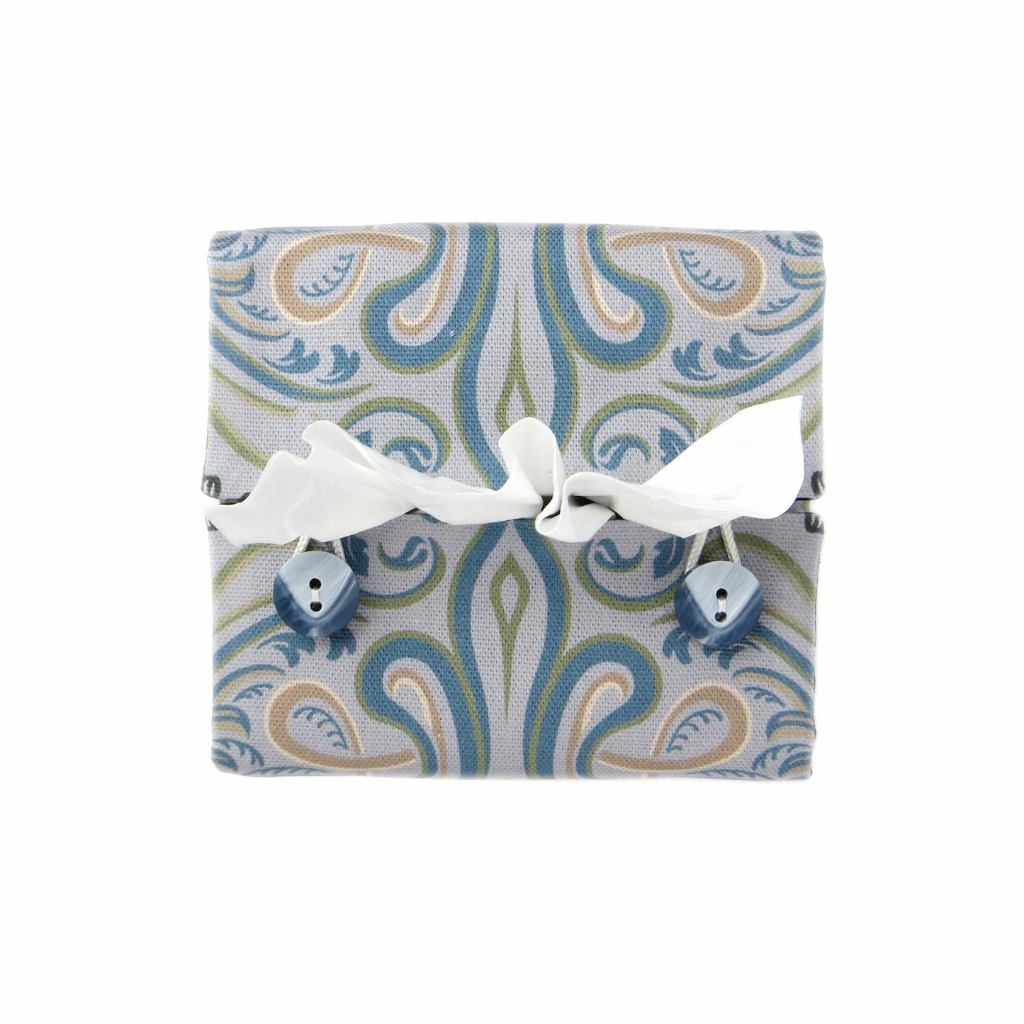 Square tissue box cover with charcoal grey and white flowers with blue, green and taupe Victorian embellishment on blue-grey background