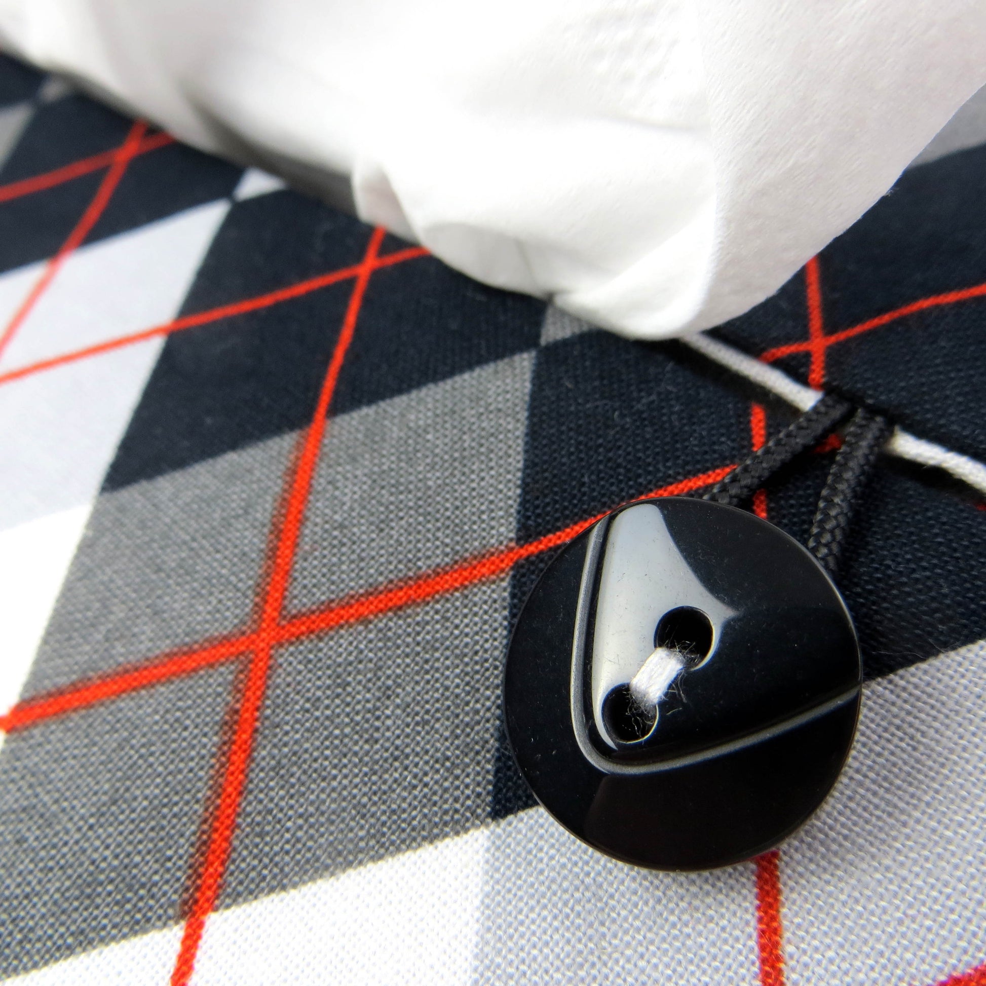 Rectangular tissue box cover with black, grey, and red argyle pattern