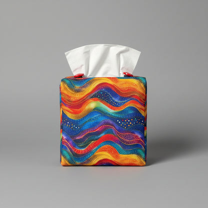 A colourful wave design square tissue box cover sitting on a grey background.