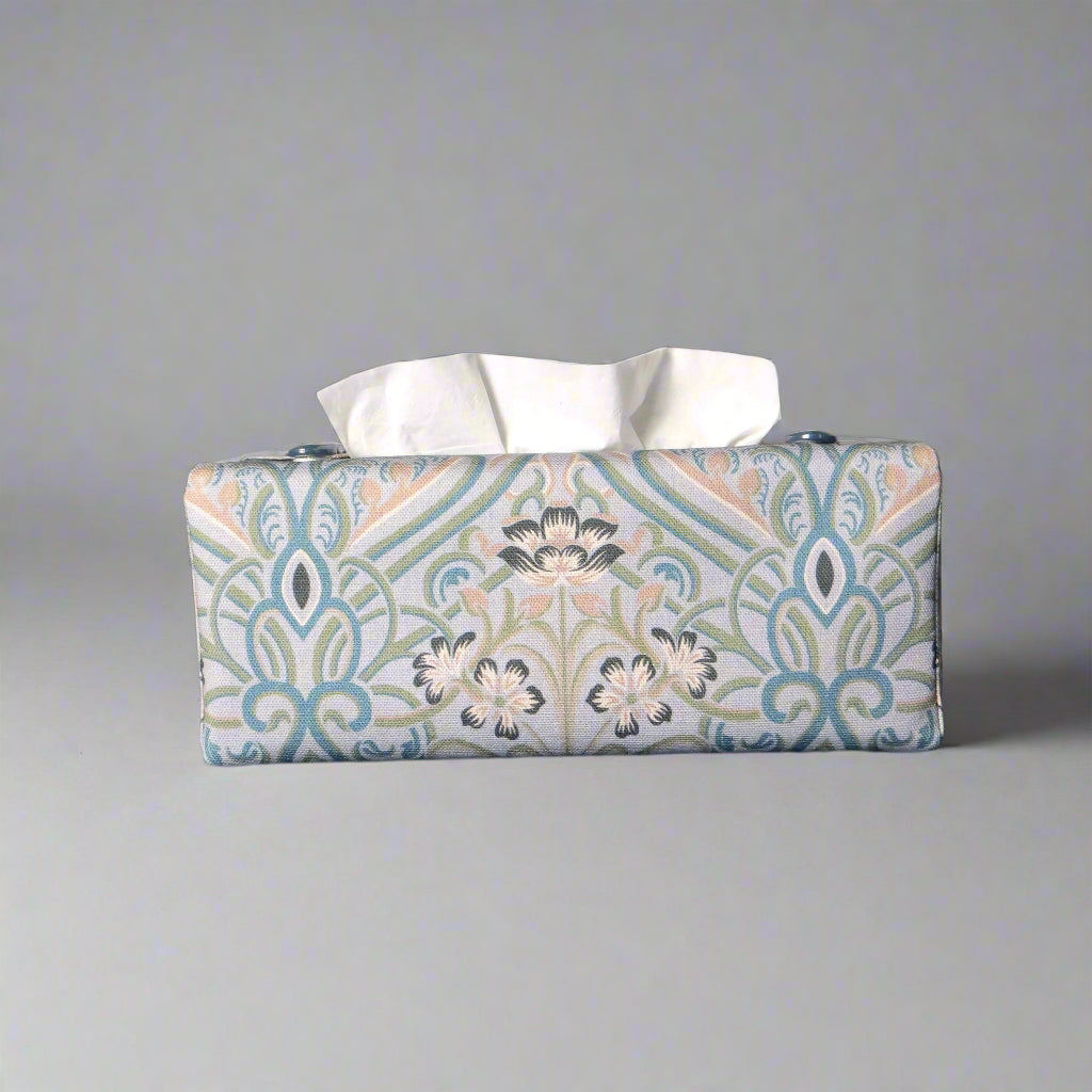 Rectangular tissue box cover with charcoal grey and white flowers with blue, green and taupe Victorian embellishment on blue-grey background