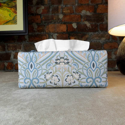 Rectangular tissue box cover with charcoal grey and white flowers with blue, green and taupe Victorian embellishment on blue-grey background